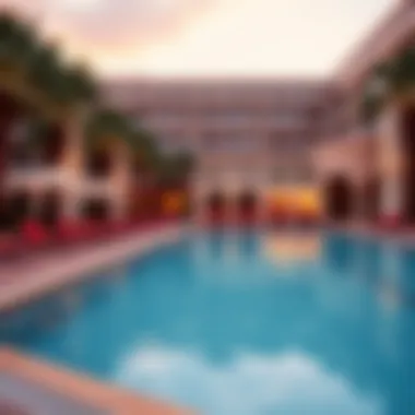 Beautiful outdoor pool area with sun loungers and palm trees